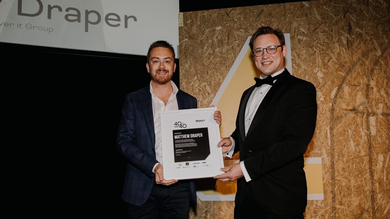 matt draper being presented with his the top 40 under 40 award